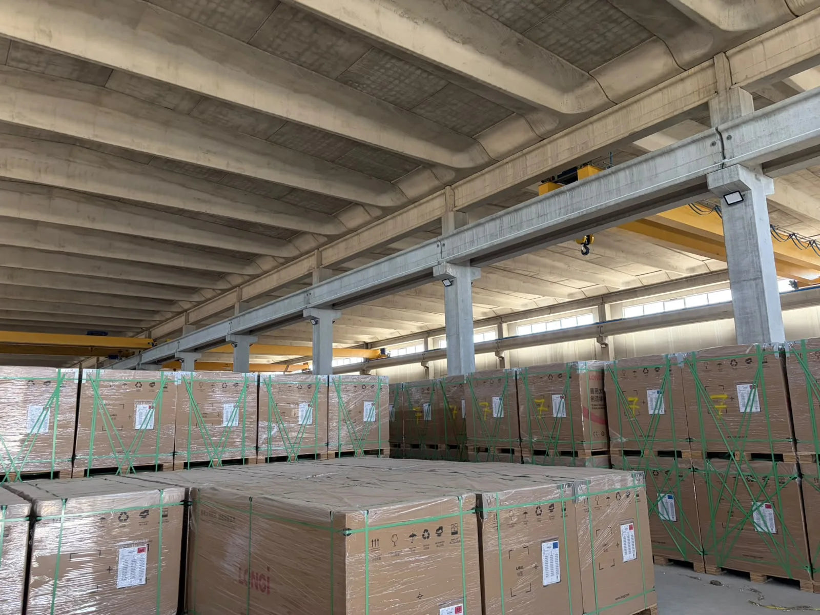 Rows of packaged solar modules ready for allocation.